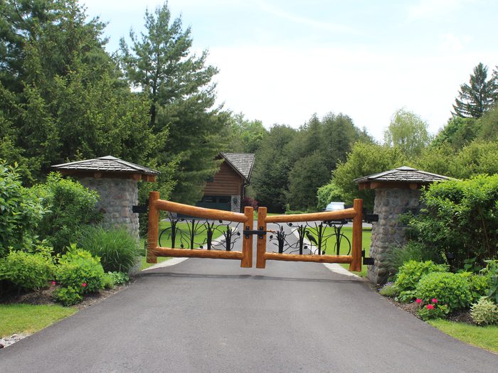 Estate gate and stone pillars landscape by Spring ECO Construction, Muskoka Ontario